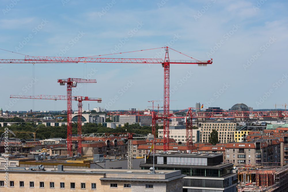 Aerial cityscape of Berlin with construction cranes