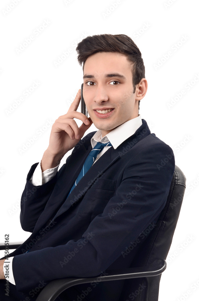 Young businessman talking on the phone.Happy phone conversation. Young businessman talking on the phone.Happy phone conversation.