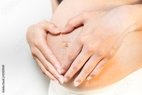 Wallpaper Mural Close up a heart shaped pregnancy of Asian Women Torontodigital.ca