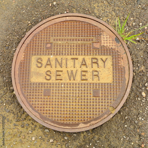 фотографія Metal Sanitary sewer manhole cover