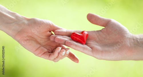 Hand proposing a heart