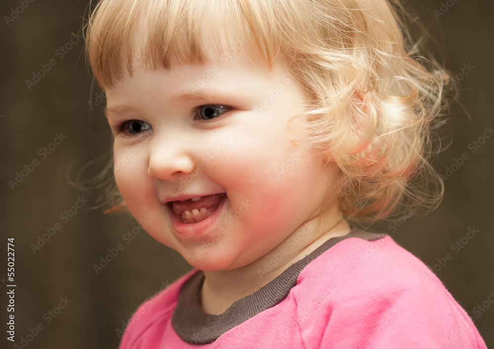 Closeup portrait of happy baby girl