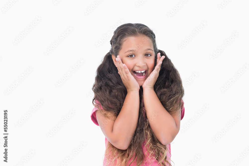 Little girl is surprising and smiling at camera Little girl is surprising and smiling at camera