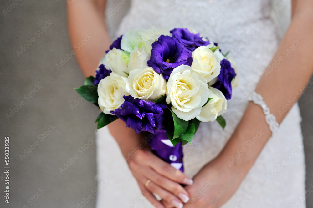 Bride hold wedding bouquet with white and lilac roses Bride hold wedding bouquet with white and lilac roses