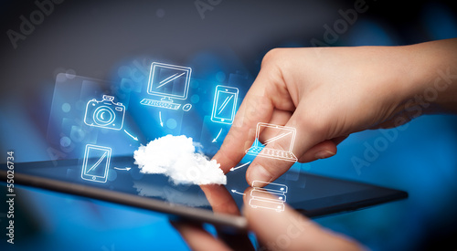 Finger pointing on tablet pc, mobile cloud concept