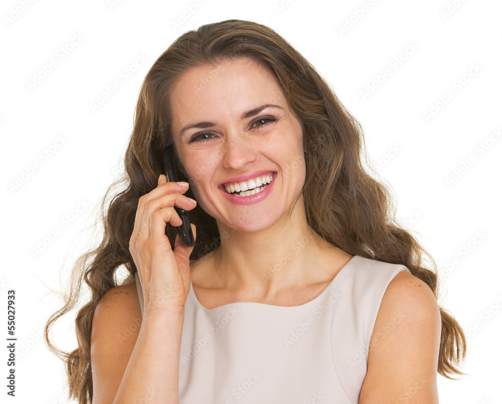 Smiling young woman talking mobile phone Smiling young woman talking mobile phone
