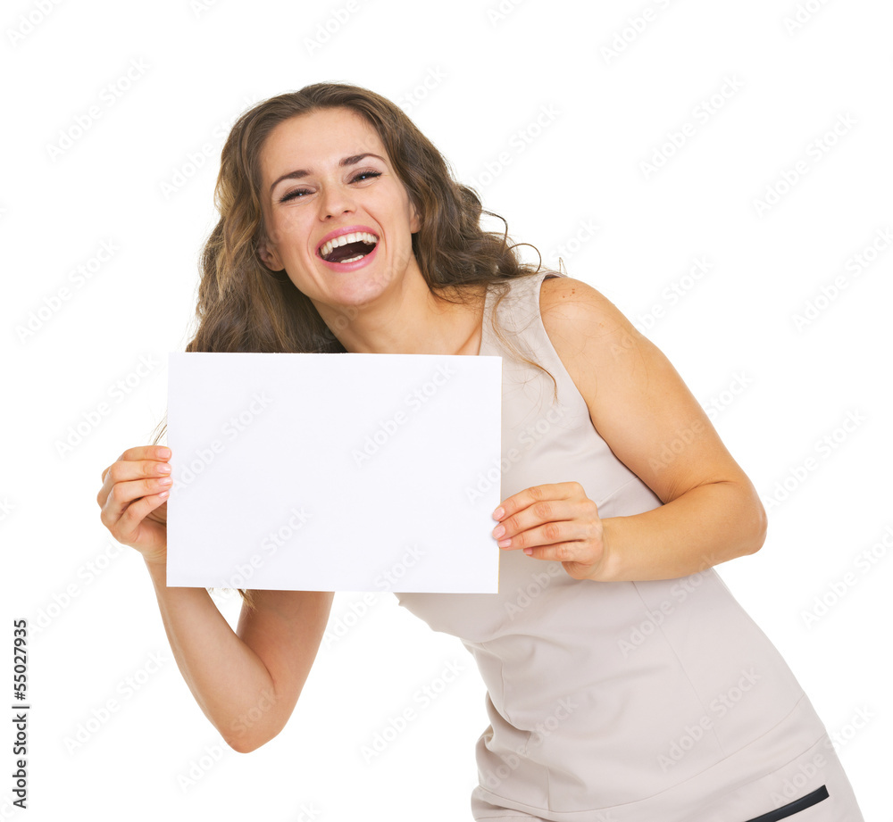 Happy young woman showing blank paper sheet Happy young woman showing blank paper sheet