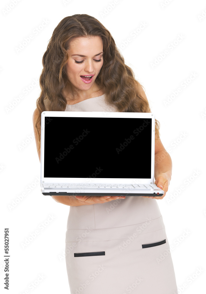 Happy young woman looking on laptop blank screen Happy young woman looking on laptop blank screen