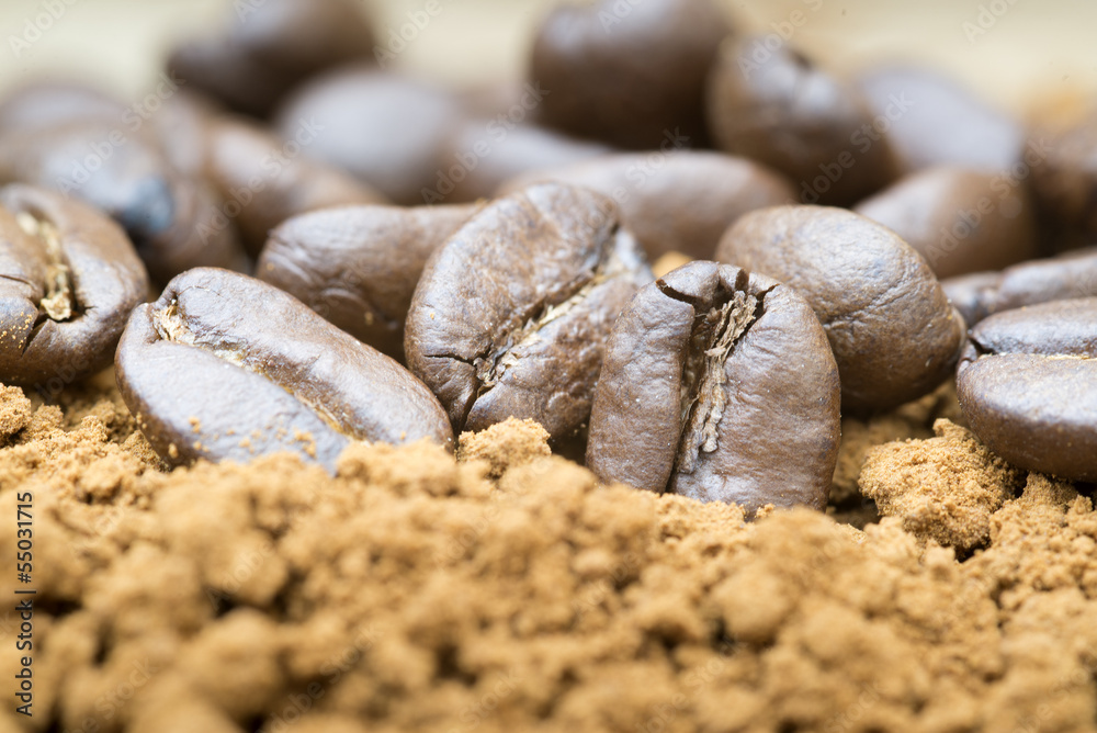 Macro image of ground coffee and coffee beans Macro image of ground coffee and coffee beans