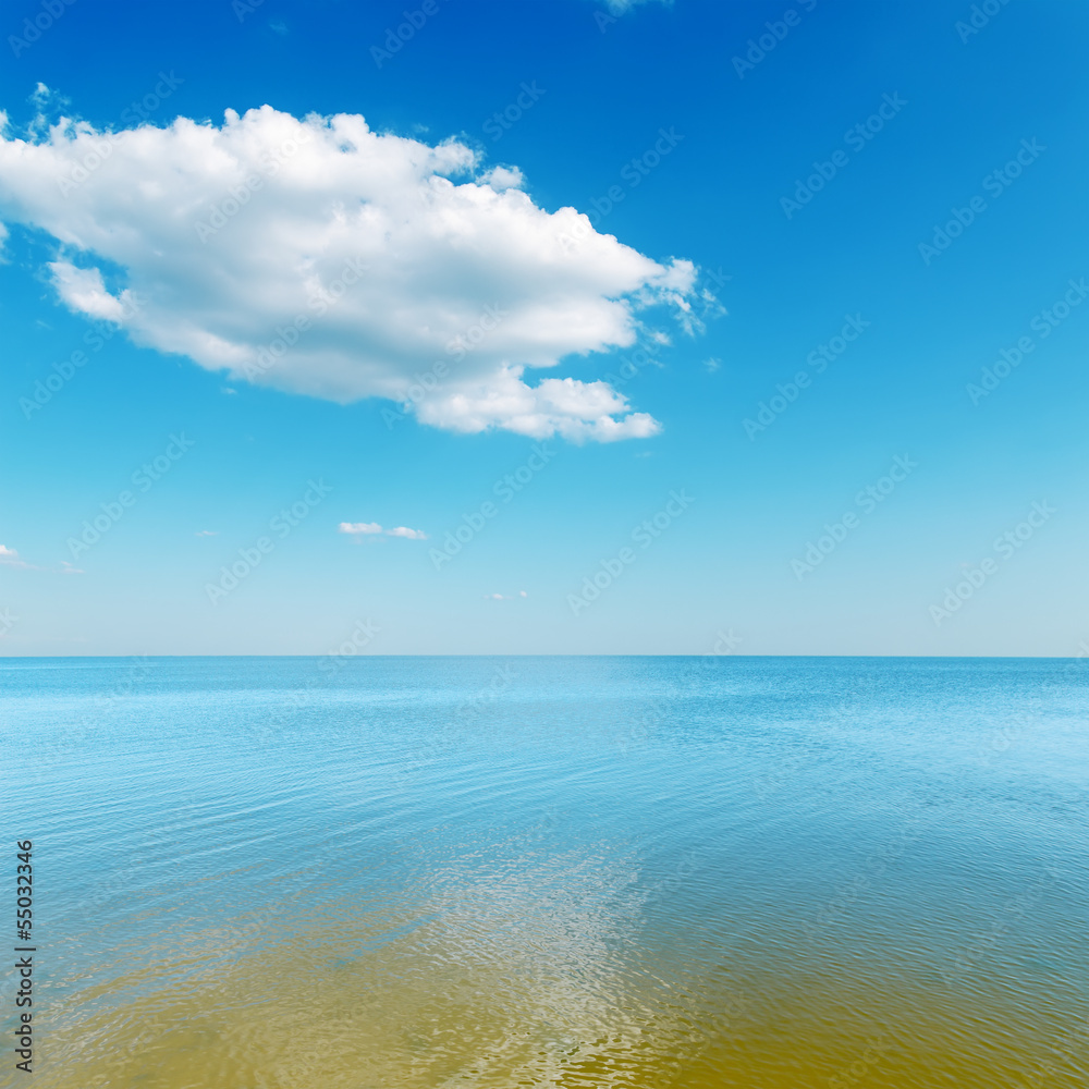 yellow color shallow waters of the sea and cloud over it