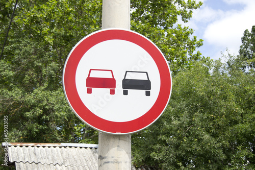 A traffic sign  (No overtaking) Give away & precedence photo