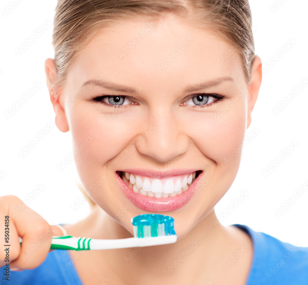 Happy woman showing her perfect white teeth holding brush Happy woman showing her perfect white teeth holding brush