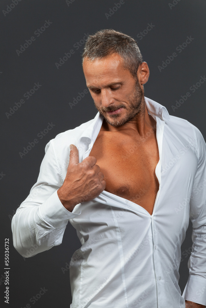adult muscular man showing his chest adult muscular man showing his chest