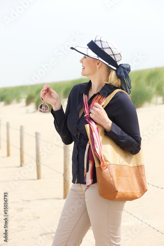 Mature woman relaxing at the beach