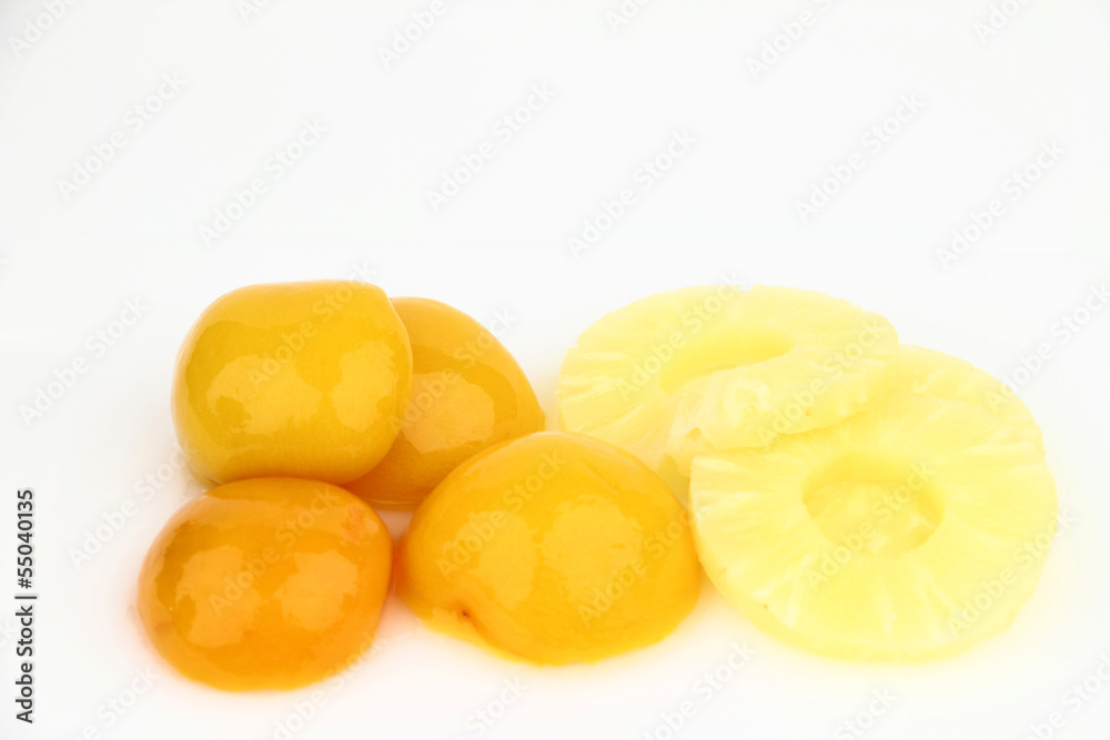 Peaches and pineapples on the white background Peaches and pineapples on the white background