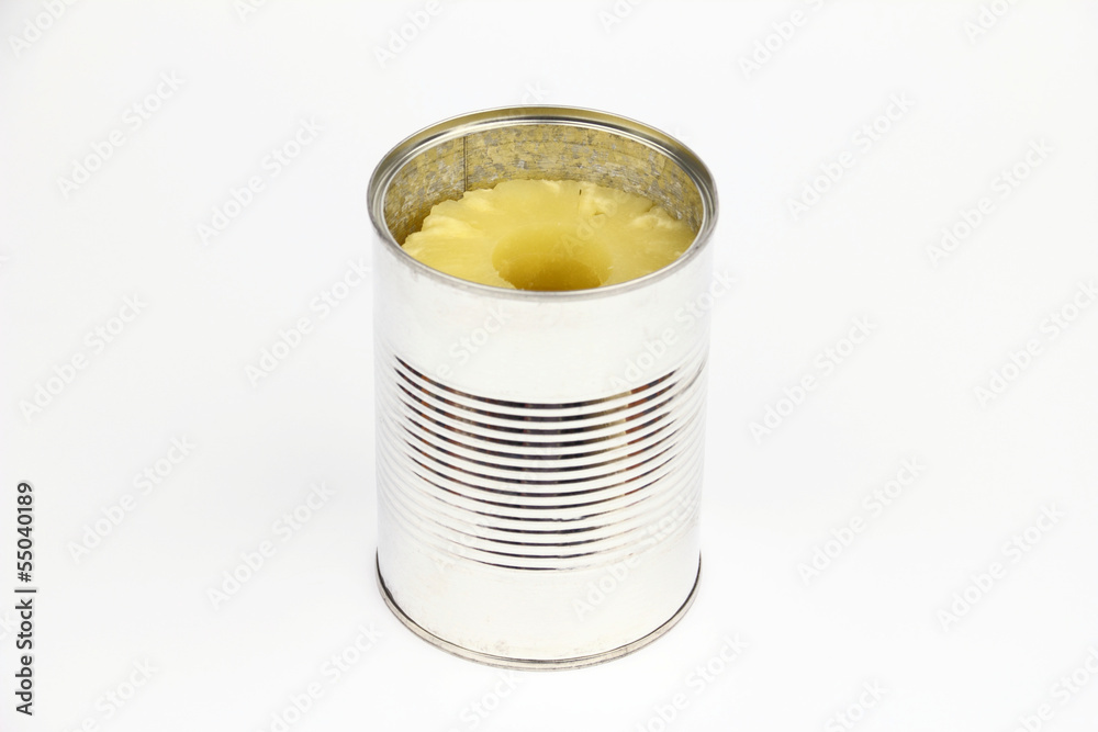 The tin with pineapples on the white background The tin with pineapples on the white background