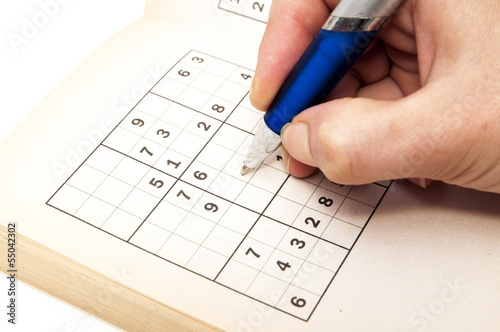 hand making a sudoku
