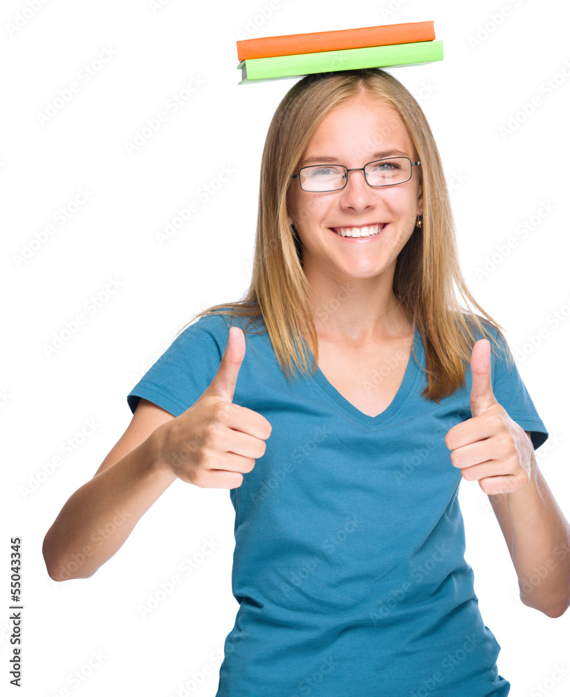 Young student girl is showing thumb up gesture Young student girl is showing thumb up gesture