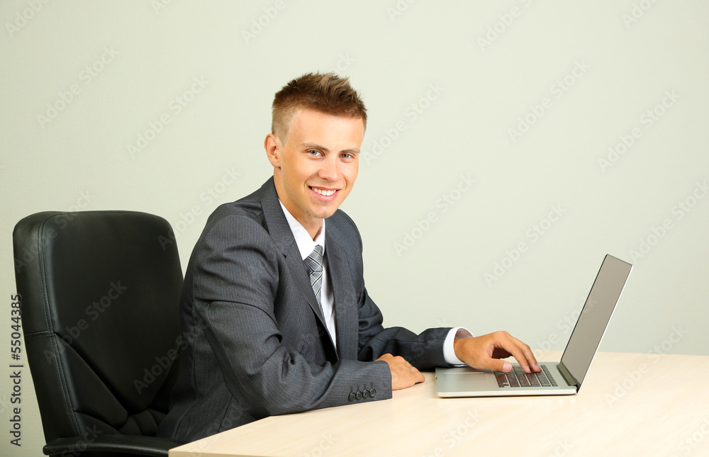 Portrait of young businessman working in office Portrait of young businessman working in office
