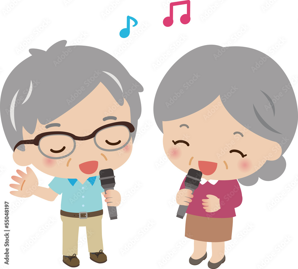 マイクを持って歌うシニアの男女