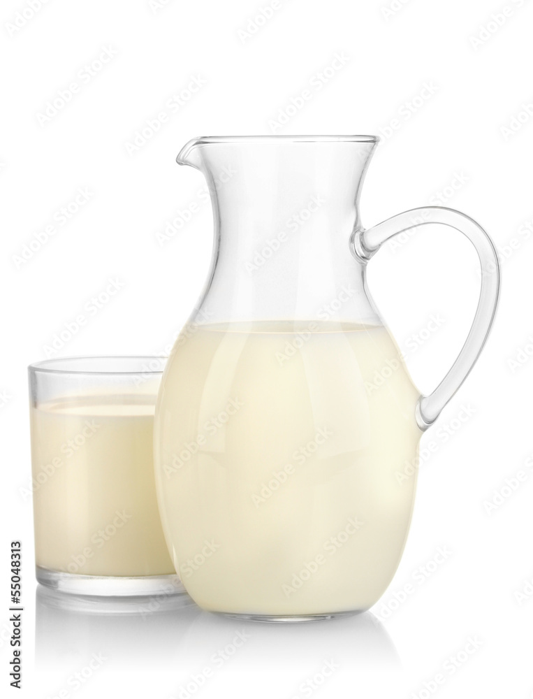 Milk in jug and glass isolated on white Milk in jug and glass isolated on white