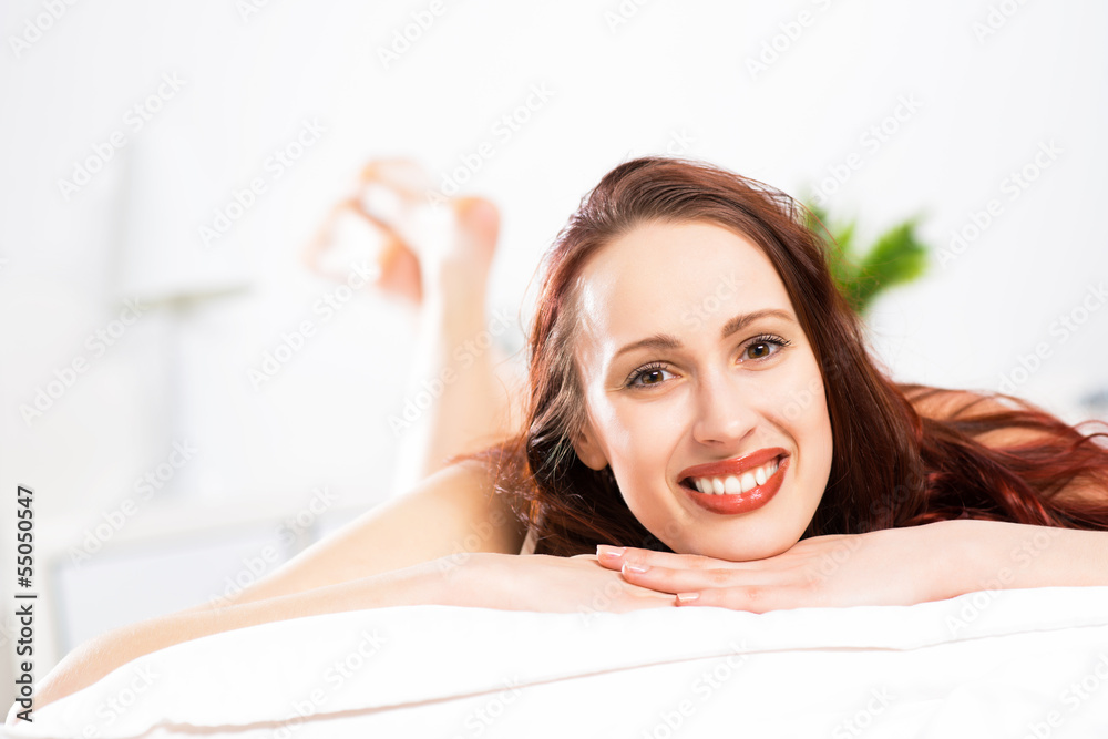 Fototapeta premium portrait of a young woman in the bedroom