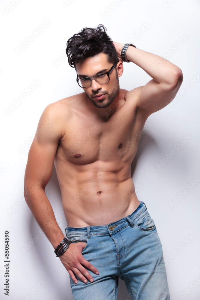 Fototapeta premium topless young man with hand behind head