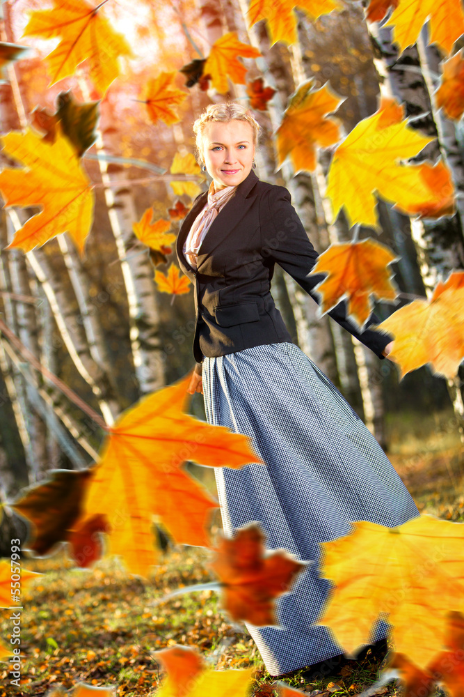 Woman and autumn leaves in the park. Woman and autumn leaves in the park.