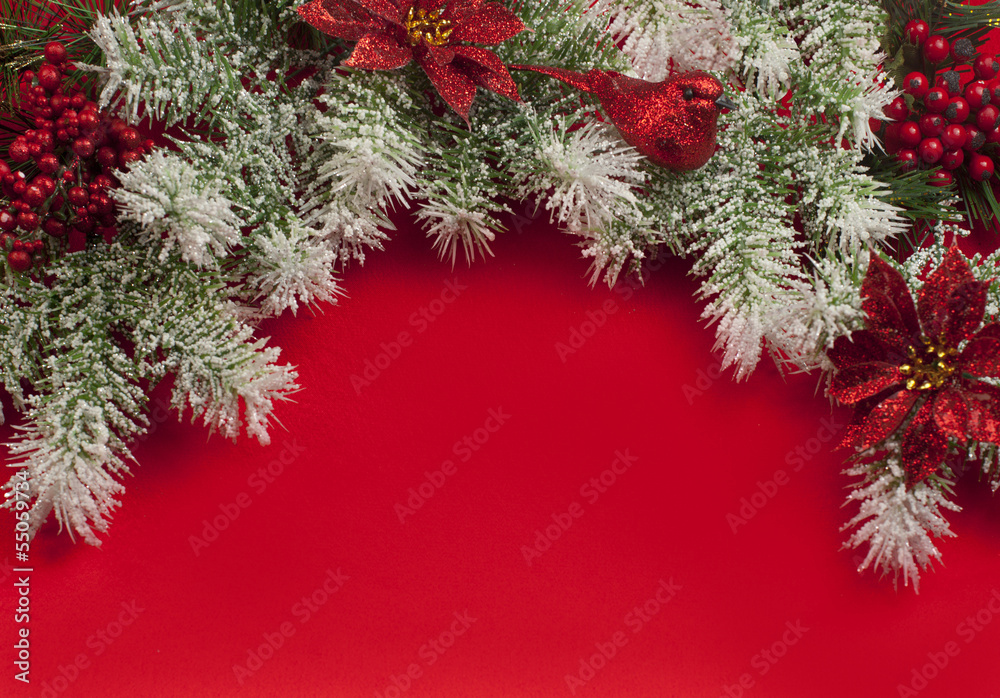 Christmas decorations over red satin