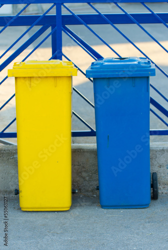 yellow and blue trash can