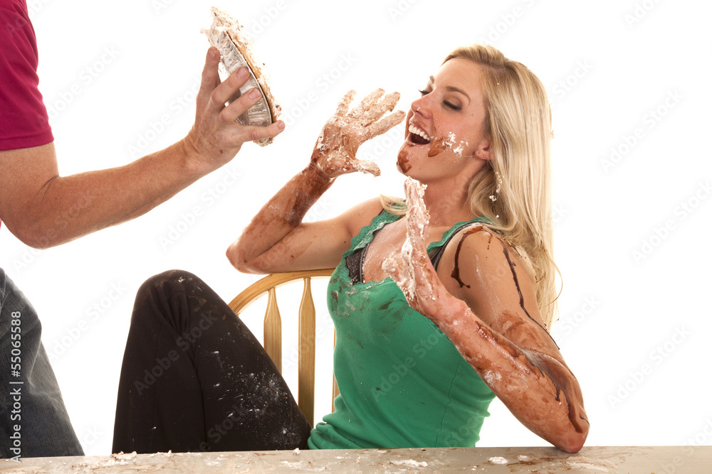 Fotografie Woman getting a pie at face