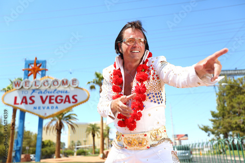 Elvis look-alike impersonator and Las Vegas sign