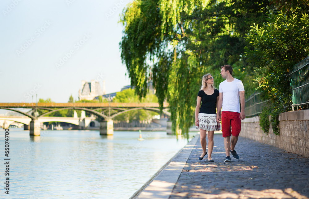 Beautiful young couple in Paris on a summer day