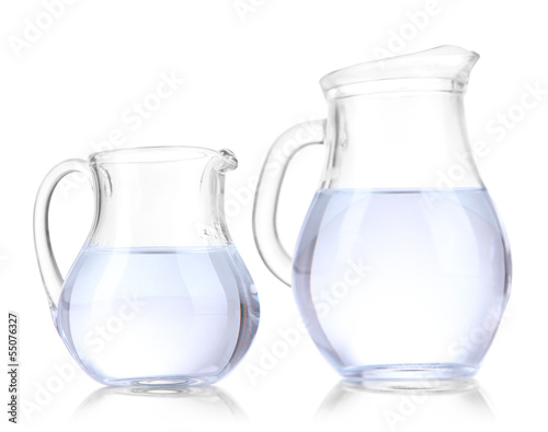 Glass pitchers of water isolated on white