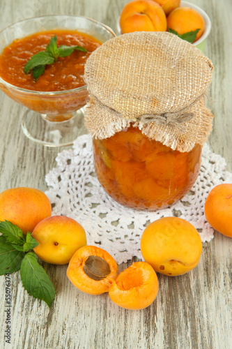 Apricot jam in glass jar and fresh apricots 