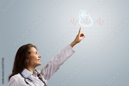 young woman doctor finger glowing heart symbol