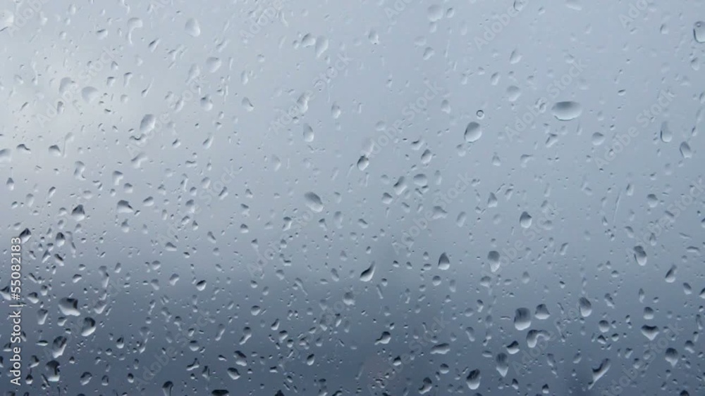Flowing down water drops on glass. Flowing down water drops on glass.