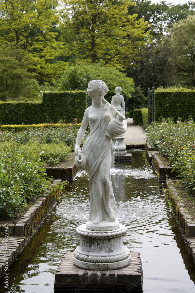 Statues and fountain in a formal garden