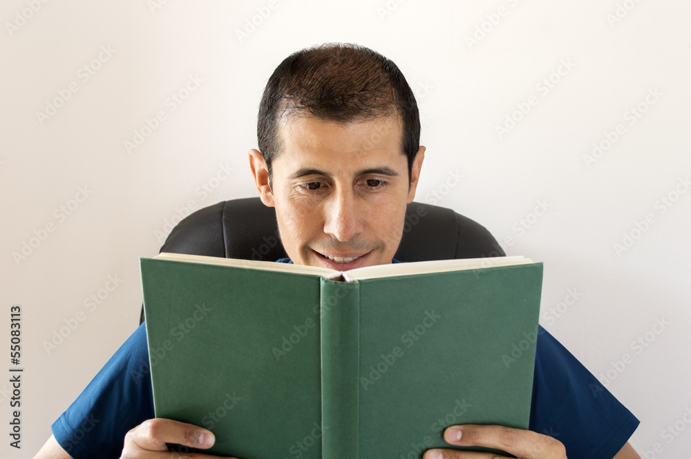 smiling man reading a book smiling man reading a book