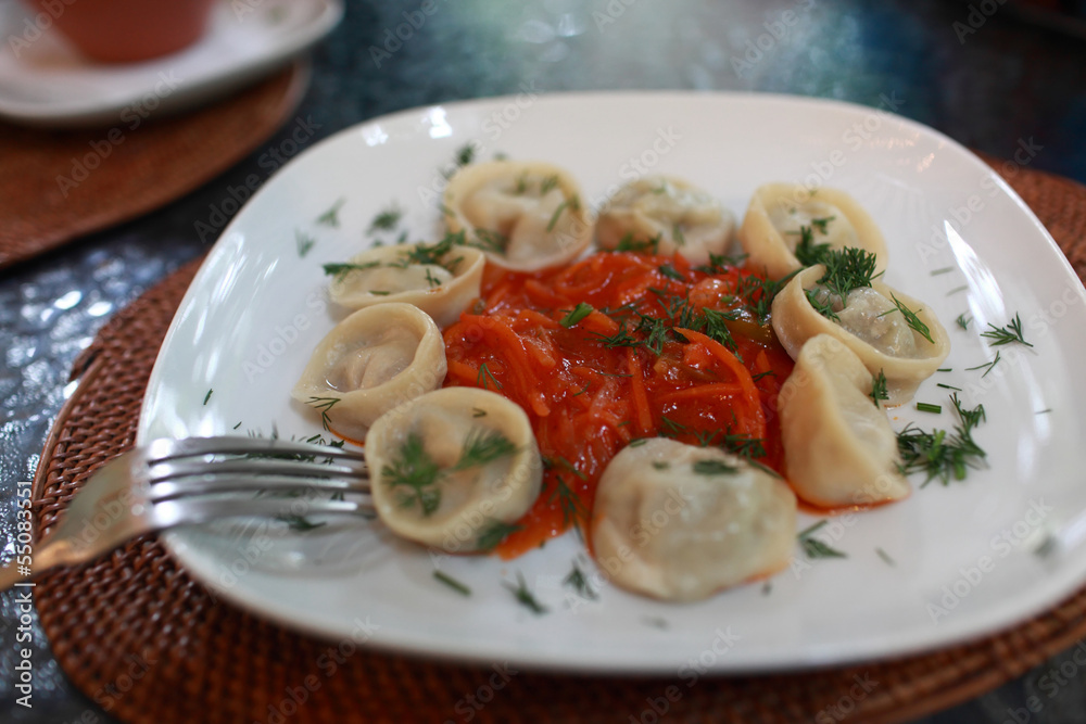 Russian pelmeni with vegetable salsa