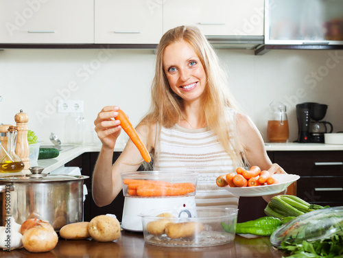 Photos woman cooking fresh vegetables with  steamer