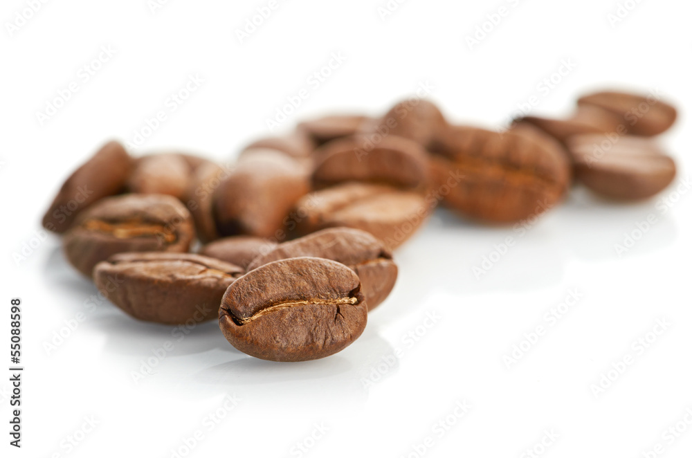 Macro of coffee beans isolated on white background Macro of coffee beans isolated on white background