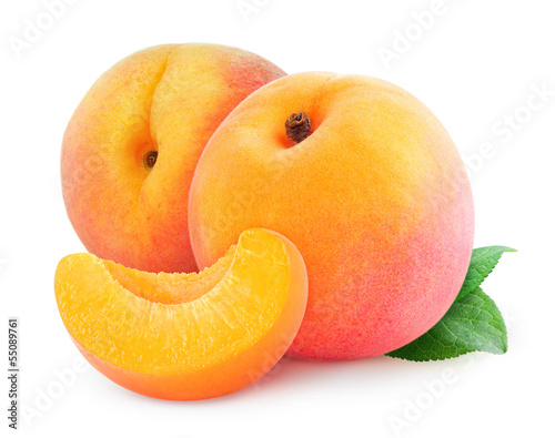 Isolated peaches. Two fresh peach fruits and a wedge isolated on white background