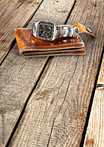 Yellow leather wallet with a clock