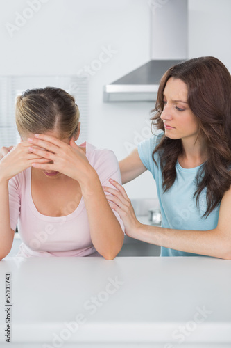 Upset woman with her friend
