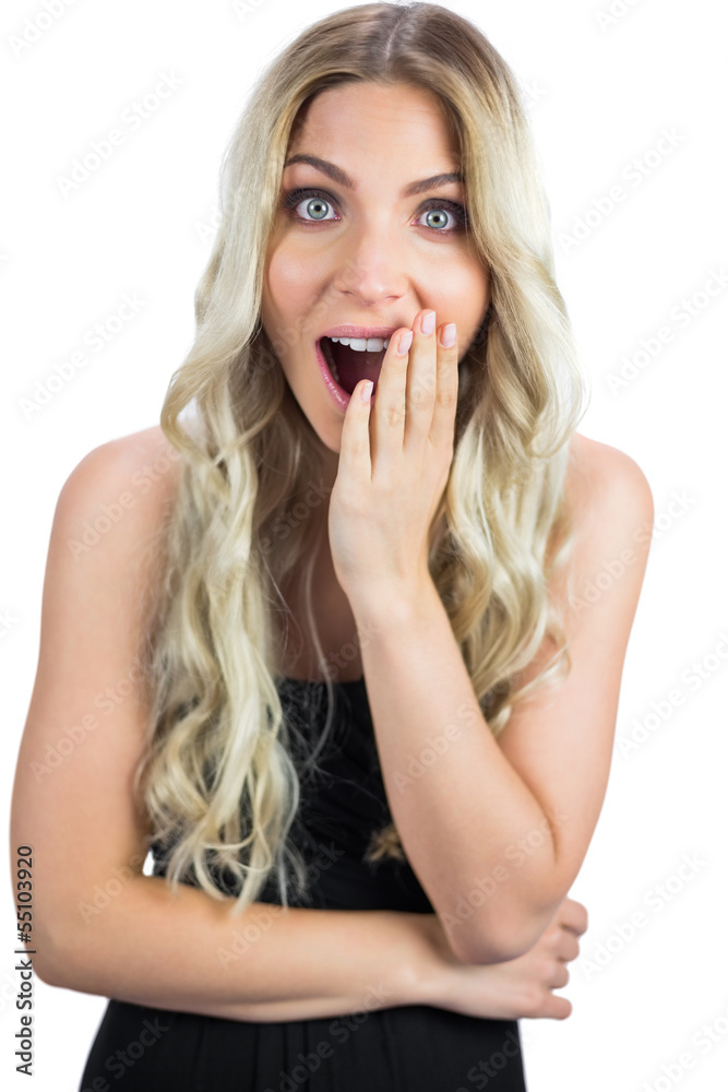 Surprised gorgeous blonde in black dress posing Surprised gorgeous blonde in black dress posing