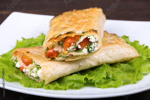 Pita bread wrapped with cottage cheese and vegetables