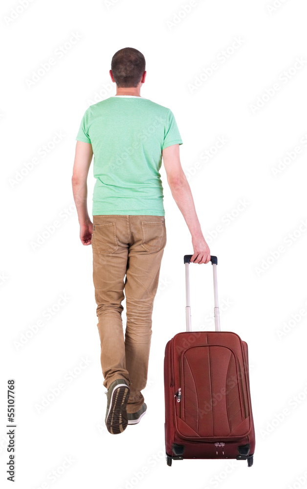 back view of walking man with suitcase. back view of walking man with suitcase.