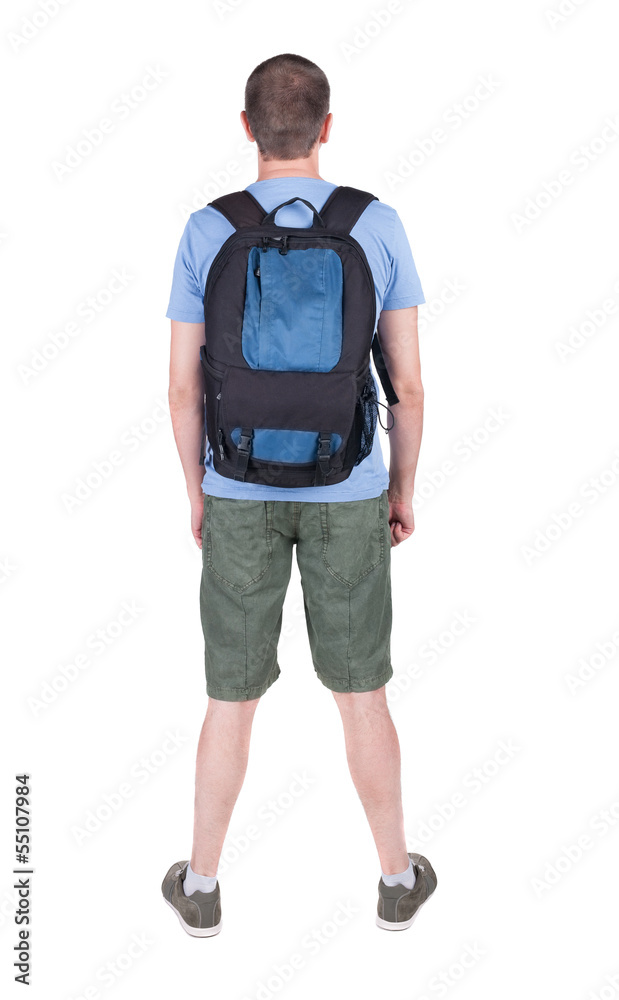 Back view of man with backpack looking up. Back view of man with backpack looking up.