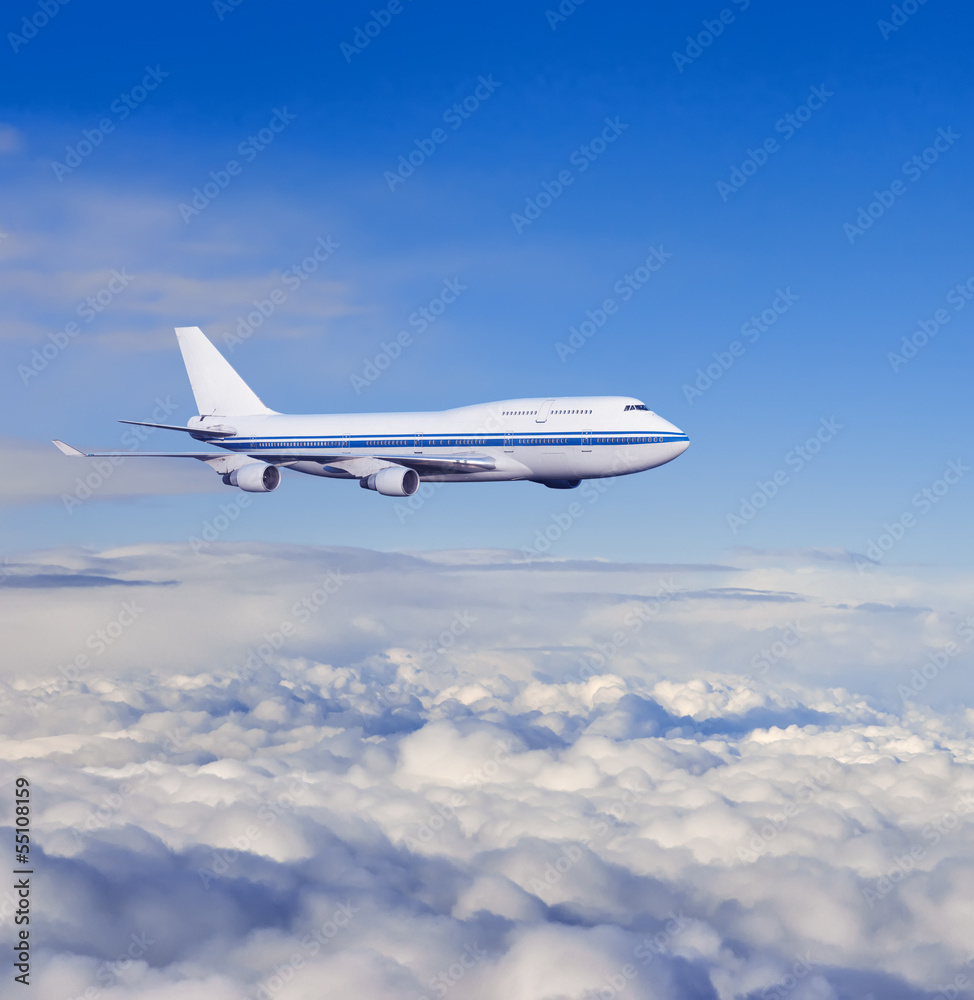 Fototapeta samolot pasażerski w chmurach.